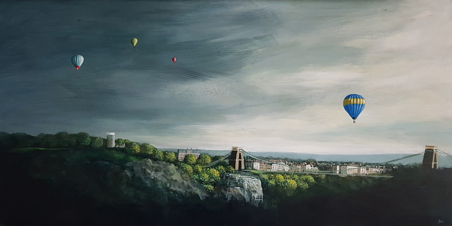 A hot air balloon floats of Clifton in Bristol ahead of a storm by Jenny Urquhart